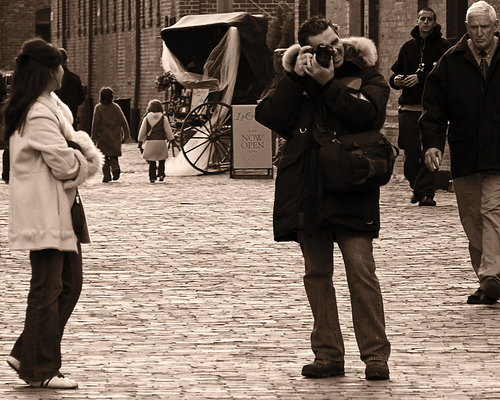 man holding digital camera